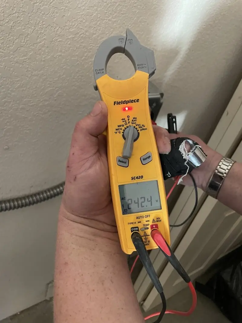 Voltage testing with clamp meter during Ceiling Fan Installation in Woodhaven